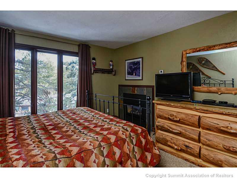 820 Columbine Road, Unit 16B Breckenridge, CO 80424 - Photo 14 of 23 a bed room with a bed and a television