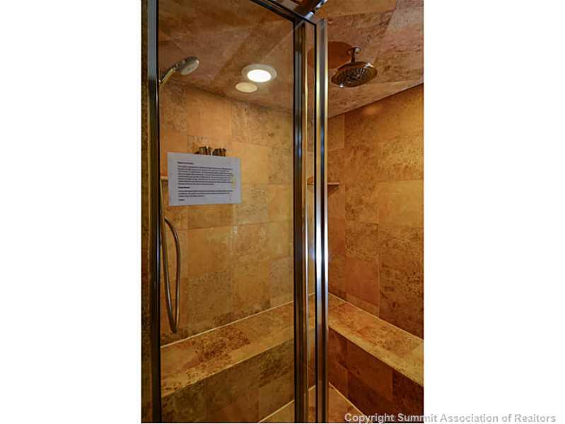 820 Columbine Road, Unit 16B Breckenridge, CO 80424 - Photo 16 of 23 a bathroom with a shower and a mirror