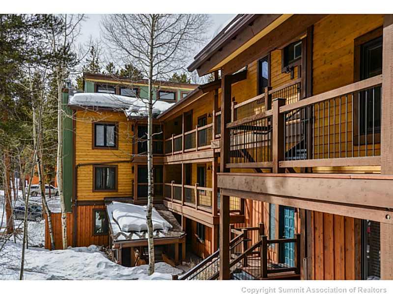 820 Columbine Road, Unit 16B Breckenridge, CO 80424 - Photo 22 of 23 a view of a brick building with many windows