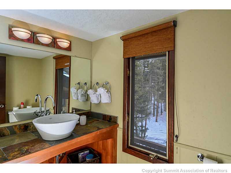 820 Columbine Road, Unit 16B Breckenridge, CO 80424 - Photo 9 of 23 a living room with furniture and wooden floor
