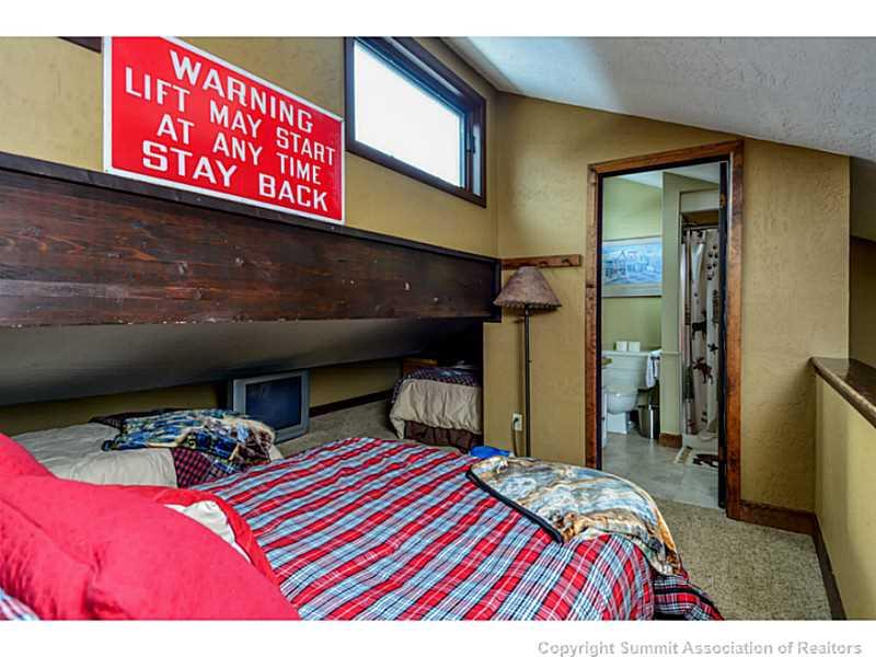 820 Columbine Road, Unit 16B Breckenridge, CO 80424 - Photo 10 of 23 a bed room with a bed and a television