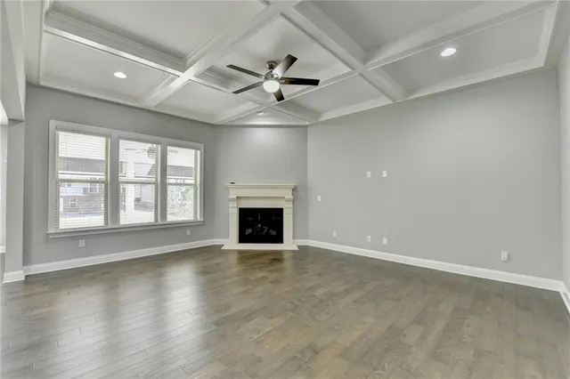 a kitchen with kitchen island granite countertop a sink a center island stainless steel appliances and cabinets