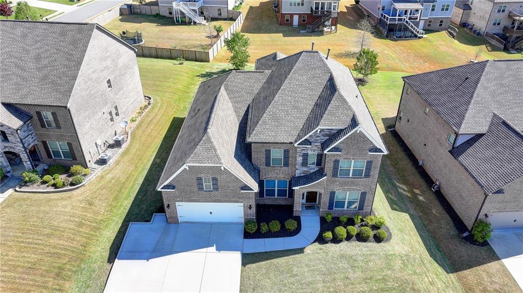 4217 Heisenberg Lane Suwanee, GA 30024 - Photo 3 of 72 a aerial view of a house with a swimming pool