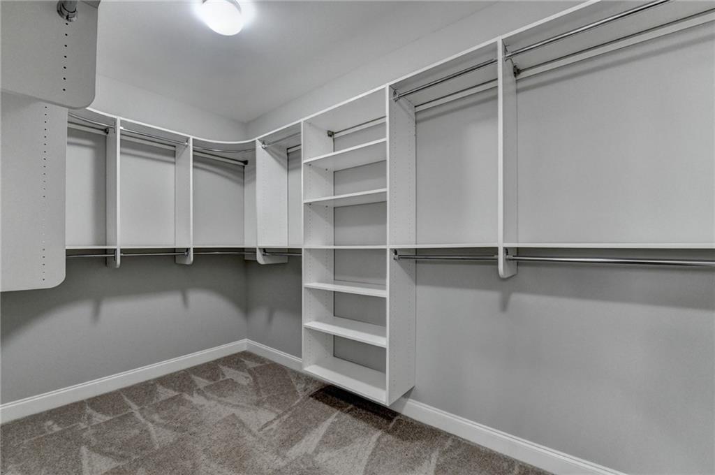 4217 Heisenberg Lane Suwanee, GA 30024 - Photo 40 of 72 a view of an empty walk in closet