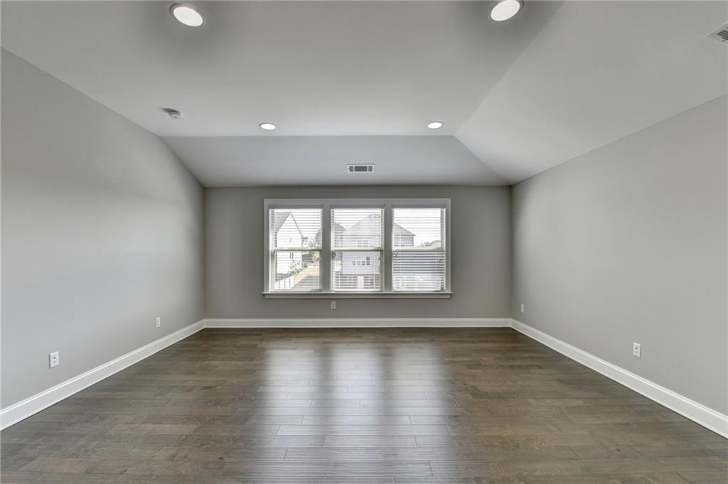 4217 Heisenberg Lane Suwanee, GA 30024 - Photo 44 of 72 wooden floor in an empty room with a window
