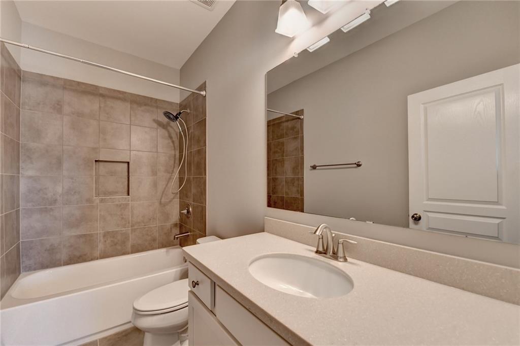 4217 Heisenberg Lane Suwanee, GA 30024 - Photo 48 of 72 a bathroom with a sink toilet and shower