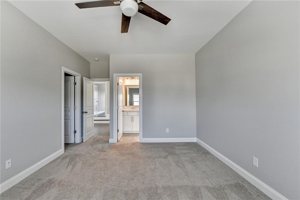 4217 Heisenberg Lane Suwanee, GA 30024 - Photo 53 of 72 an empty room with closet and windows