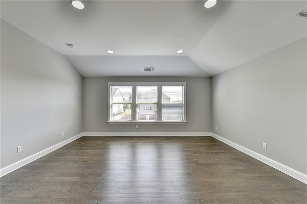 4217 Heisenberg Lane Suwanee, GA 30024 - Photo 56 of 72 wooden floor in an empty room with a window