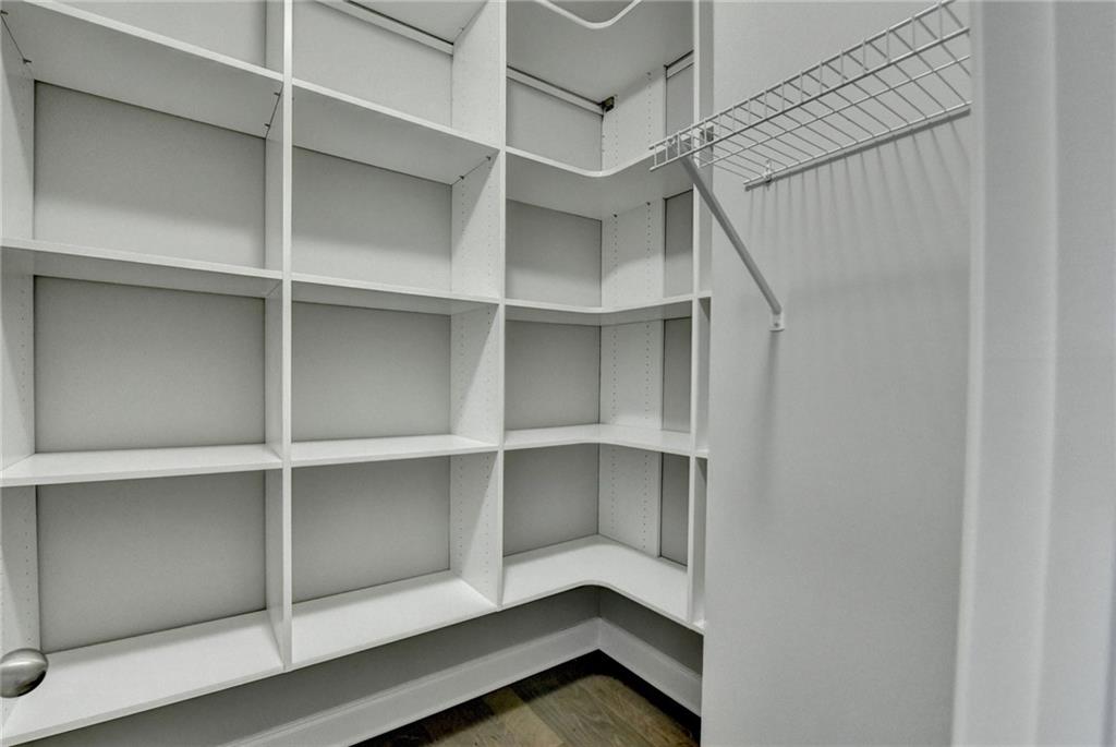 4217 Heisenberg Lane Suwanee, GA 30024 - Photo 60 of 72 a view of walk in closet with empty racks