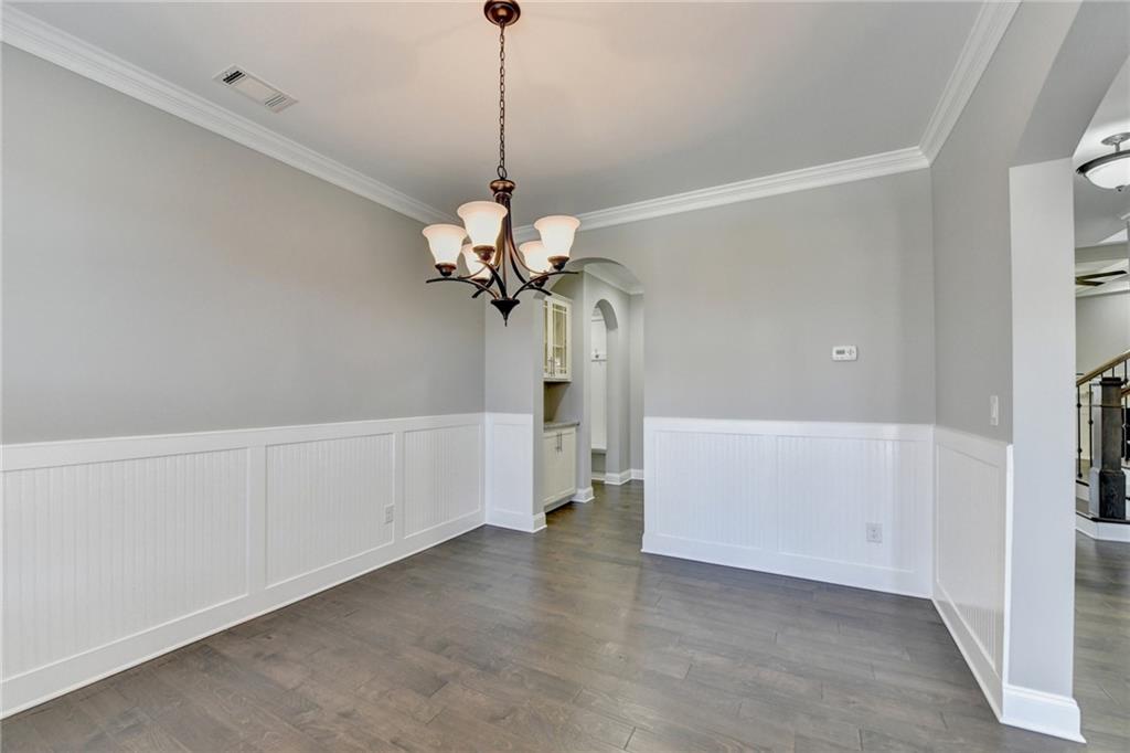 4217 Heisenberg Lane Suwanee, GA 30024 - Photo 9 of 72 a view of a kitchen with a sink and dishwasher