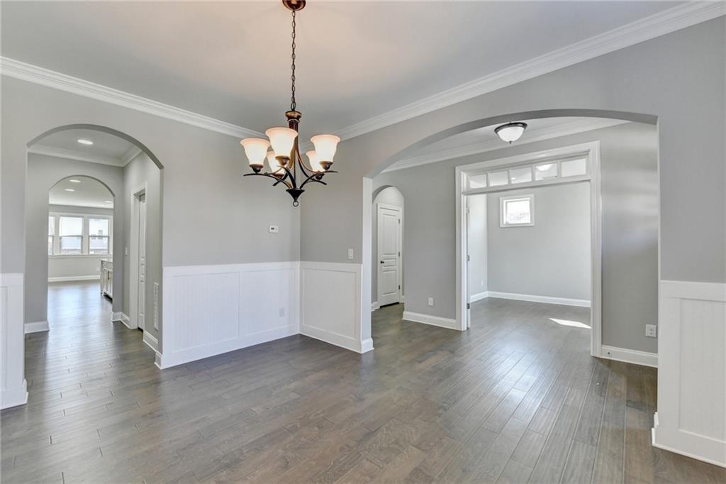 4217 Heisenberg Lane Suwanee, GA 30024 - Photo 10 of 72 a view of a livingroom with wooden floor