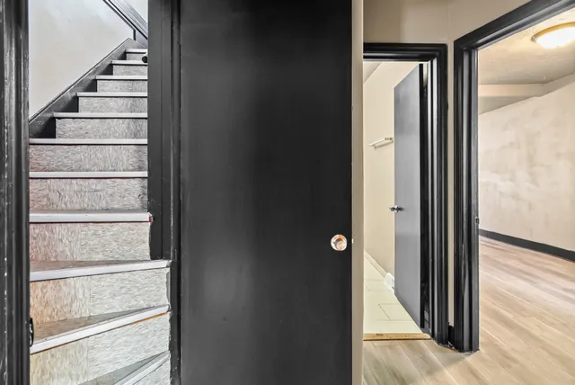 a bathroom with a sink a toilet and mirror