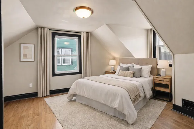 a bedroom with a bed and window