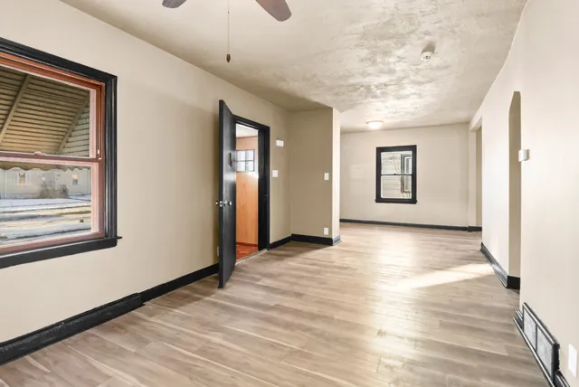 a view of livingroom with hardwood floor and hallway