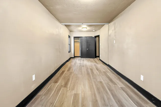 a view of an empty room and a window