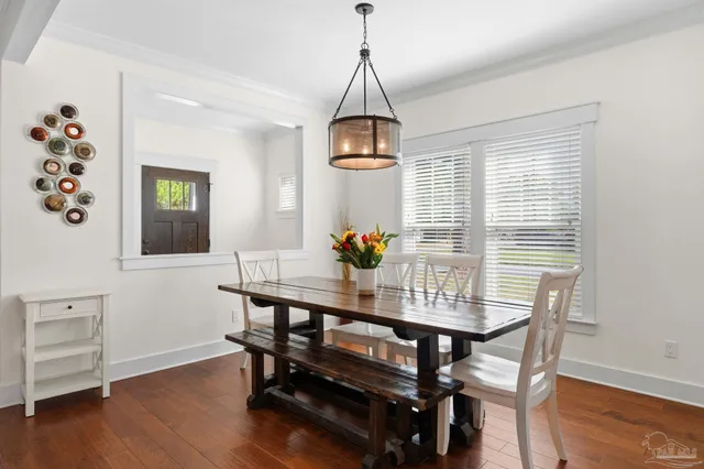 a dining room with furniture and window