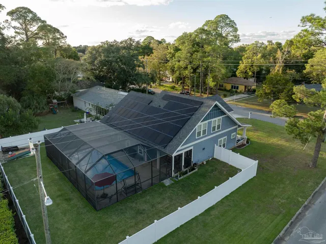 a view of a house with a backyard