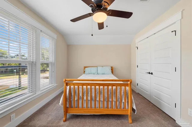 a bedroom with a bed and furniture