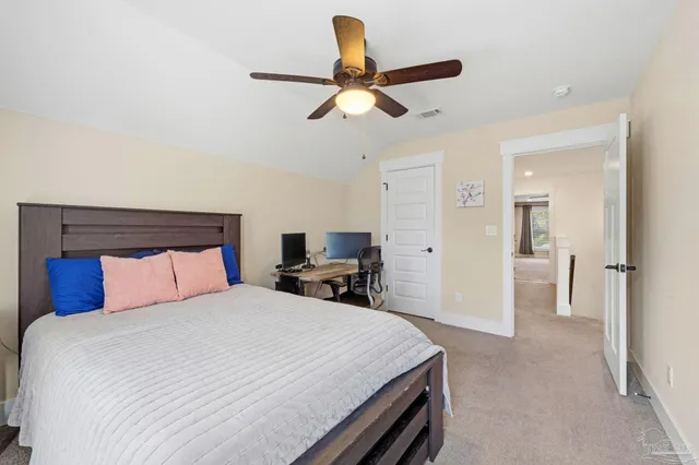 a bathroom with a granite countertop sink a toilet and a mirror