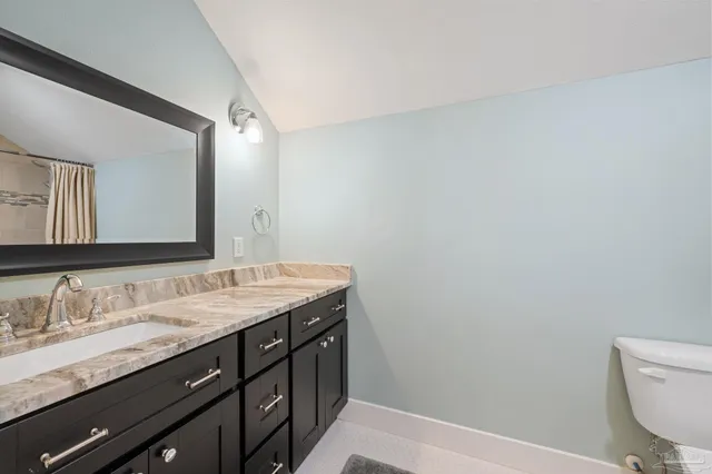 a bathroom with a toilet and a bathtub