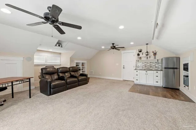 a kitchen with cabinets and stainless steel appliances