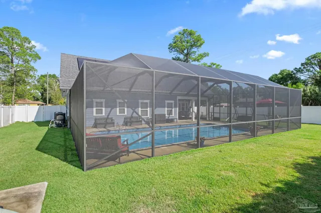 a front view of a house with a yard and porch