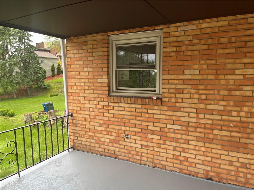 1466 Cathell Road Pittsburgh, PA 15236 - Photo 31 of 32 a view of a brick house with a large window