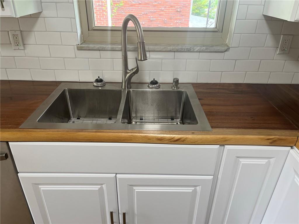1466 Cathell Road Pittsburgh, PA 15236 - Photo 9 of 32 a kitchen with a sink and a stove top oven