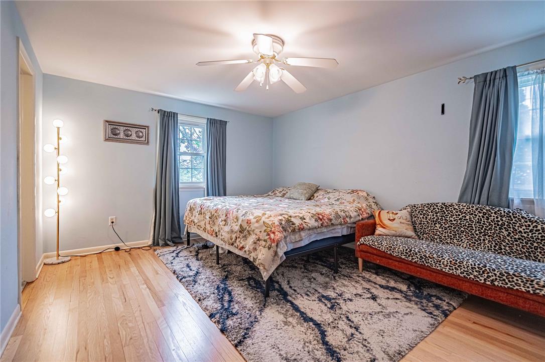 285 Bridle Path Road Bethlehem, PA 18017 - Photo 24 of 54 a bedroom with a bed and a chandelier