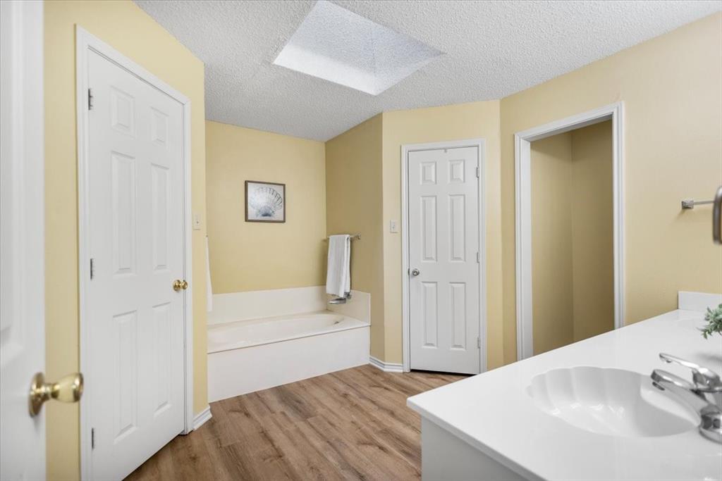 2824 Crestview Avenue Tyler, TX 75701 - Photo 28 of 39 a bathroom with a sink and a mirror
