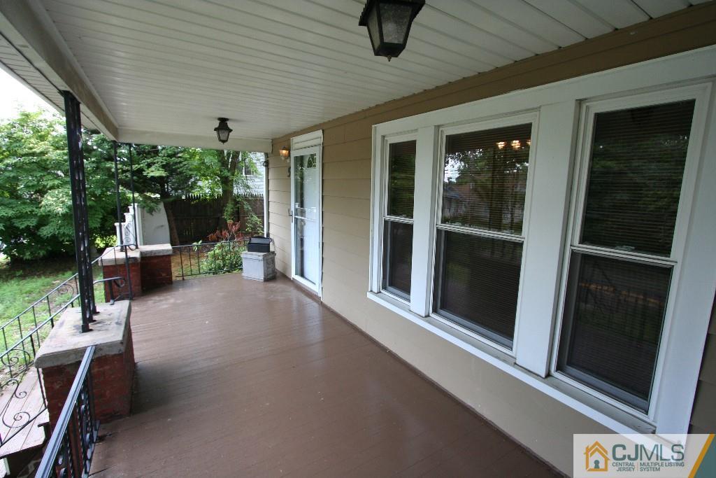 5 Washington Road Sayreville, NJ 08859 - Photo 2 of 20 a view of a porch with furniture and floor to ceiling window