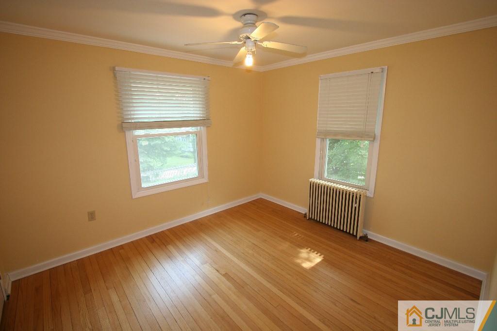 5 Washington Road Sayreville, NJ 08859 - Photo 14 of 20 a view of a livingroom with wooden floor and a window