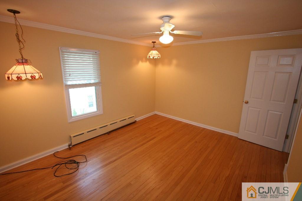 5 Washington Road Sayreville, NJ 08859 - Photo 15 of 20 a view of a room with wooden floor and fan