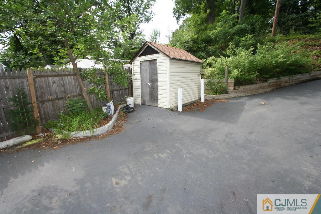 5 Washington Road Sayreville, NJ 08859 - Photo 17 of 20 a view of a house with backyard and trees