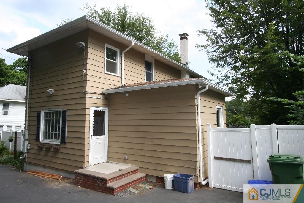 5 Washington Road Sayreville, NJ 08859 - Photo 18 of 20 a front view of a house with a garden