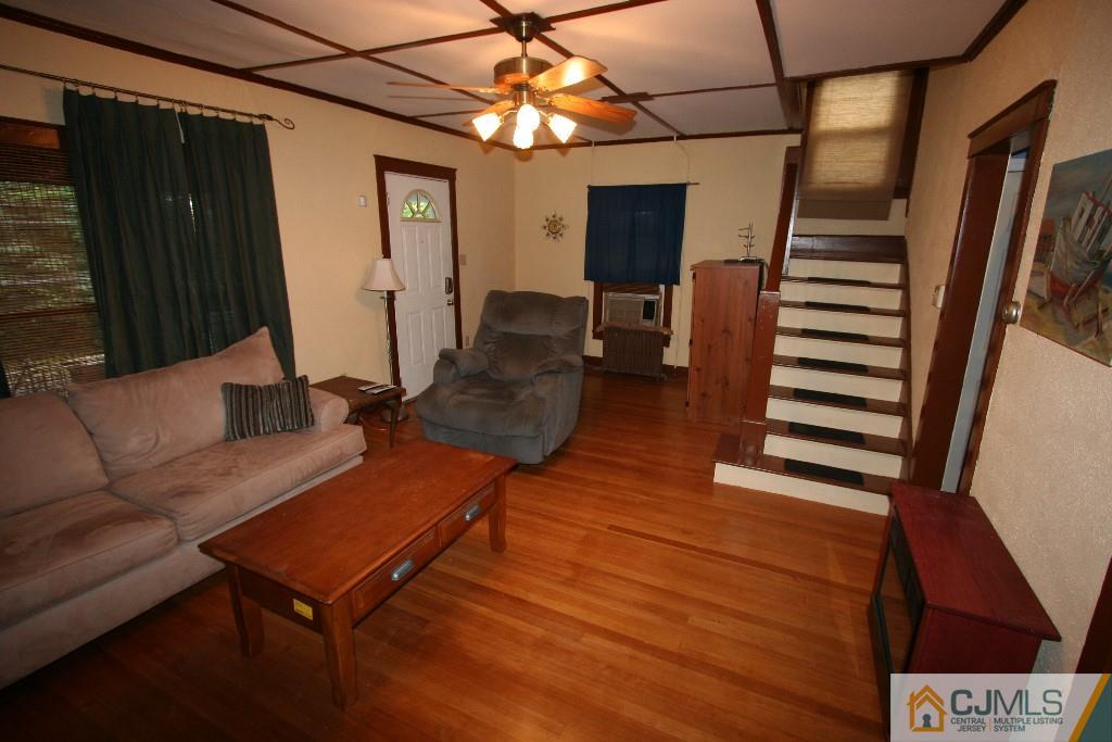 5 Washington Road Sayreville, NJ 08859 - Photo 5 of 20 a living room with furniture and a wooden floor