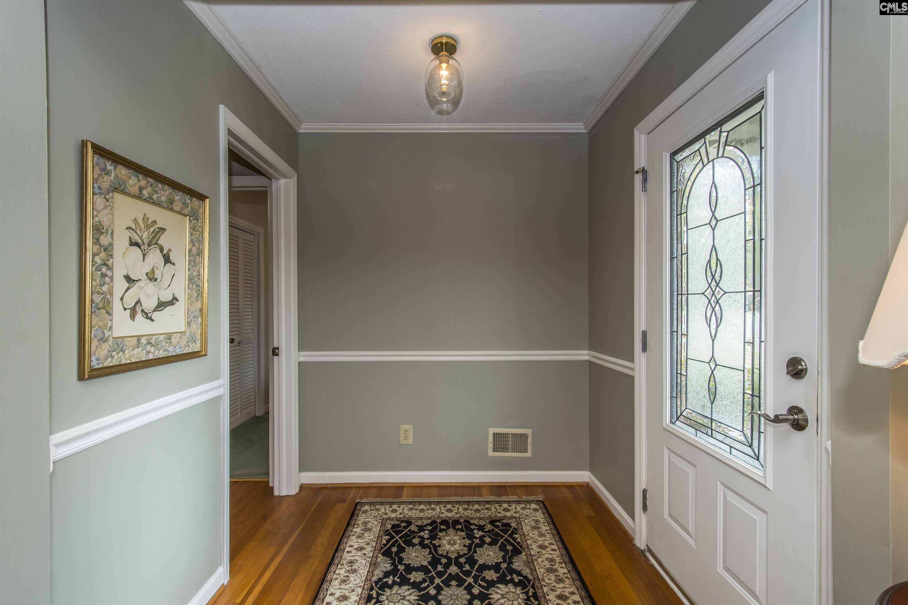 2309 Cunningham Road Columbia, SC 29210 - Photo 16 of 41 a view of a hallway with wooden floor and a window