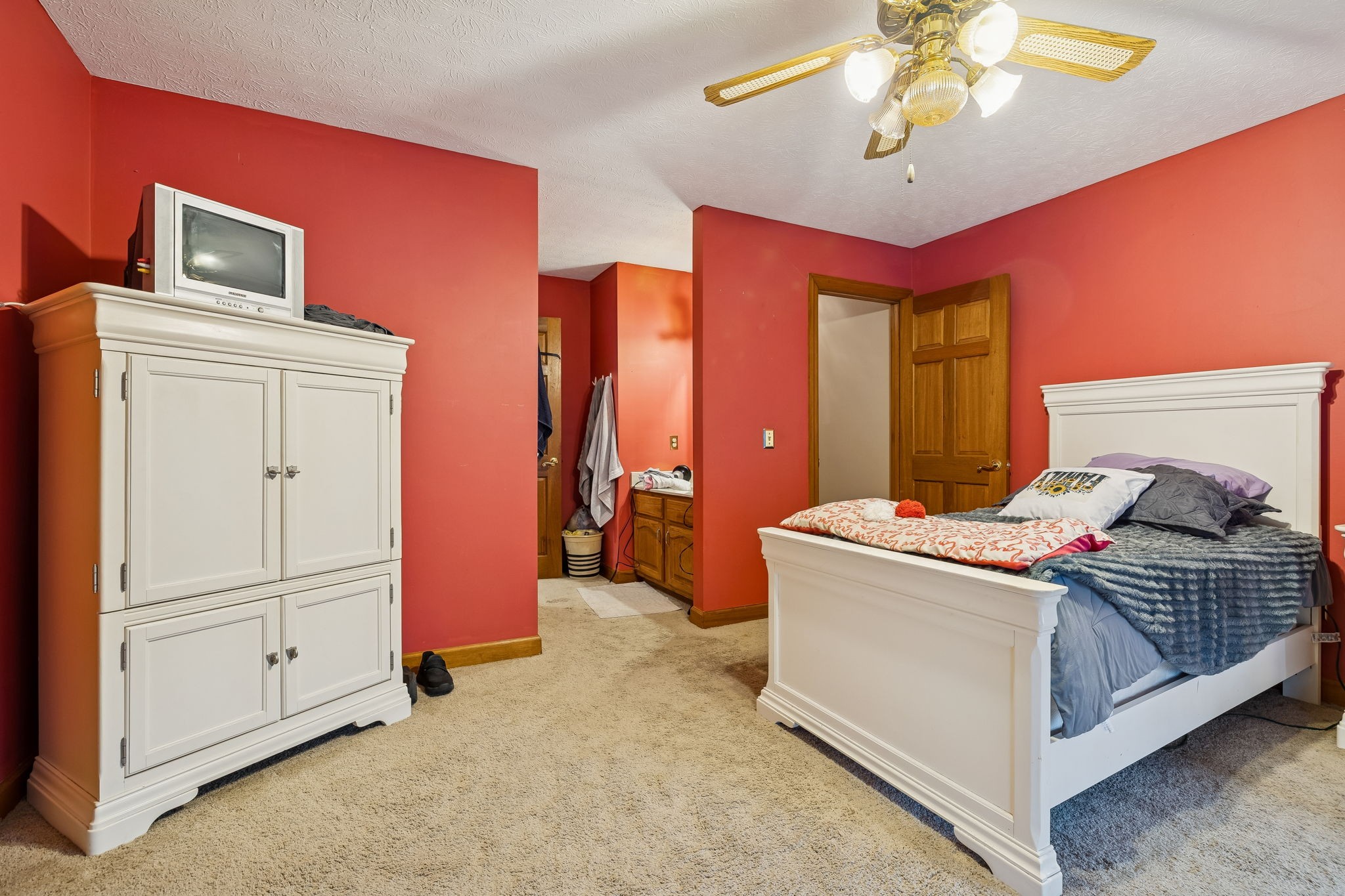 121 Kimberly Lane Pleasant View, TN 37146 - Photo 16 of 42 a bedroom with a bed and a chandelier