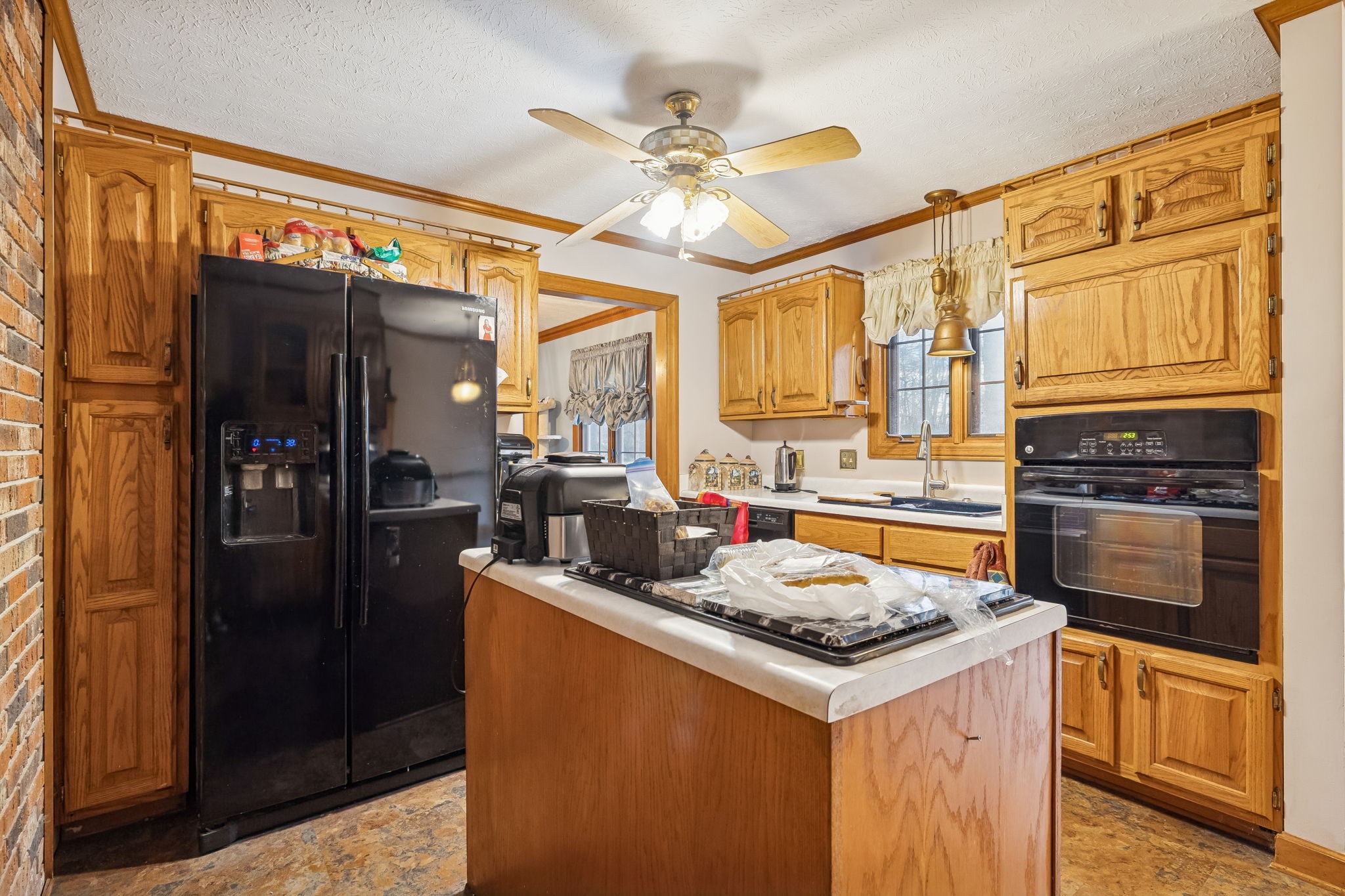 121 Kimberly Lane Pleasant View, TN 37146 - Photo 20 of 42 a kitchen with stainless steel appliances granite countertop a sink stove and refrigerator