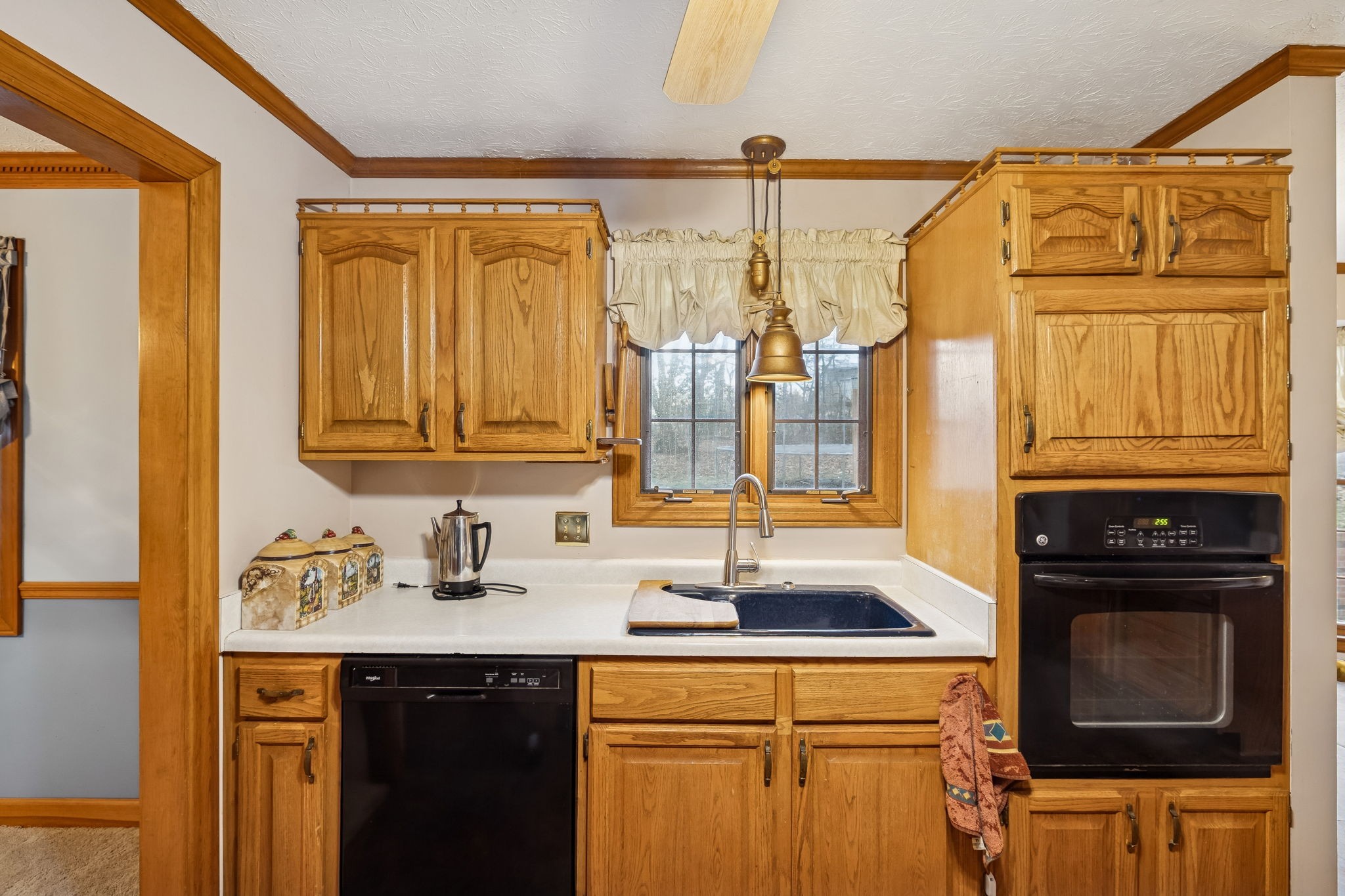 121 Kimberly Lane Pleasant View, TN 37146 - Photo 21 of 42 a kitchen with a sink and cabinets