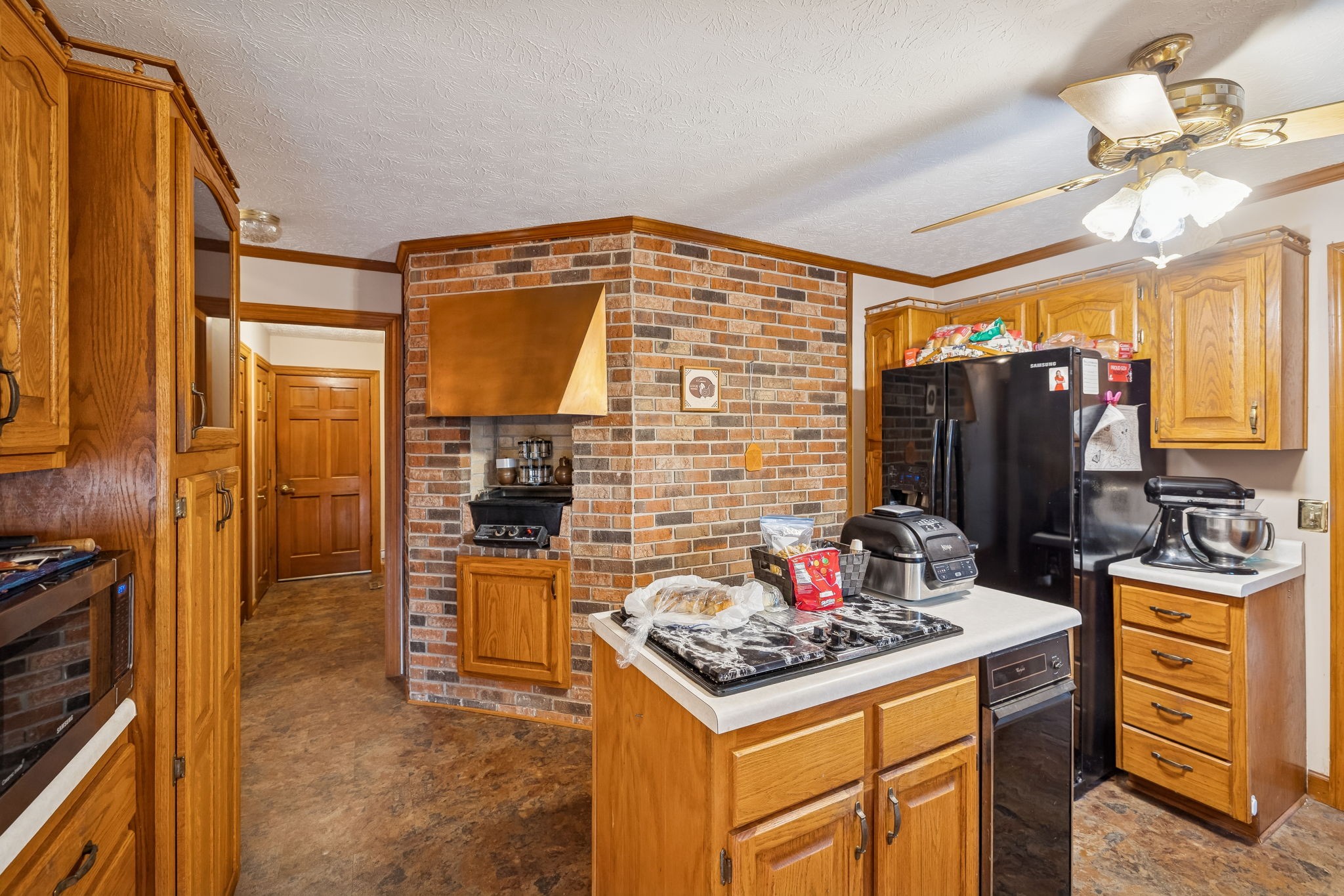 121 Kimberly Lane Pleasant View, TN 37146 - Photo 22 of 42 a kitchen with a stove top oven sink and refrigerator