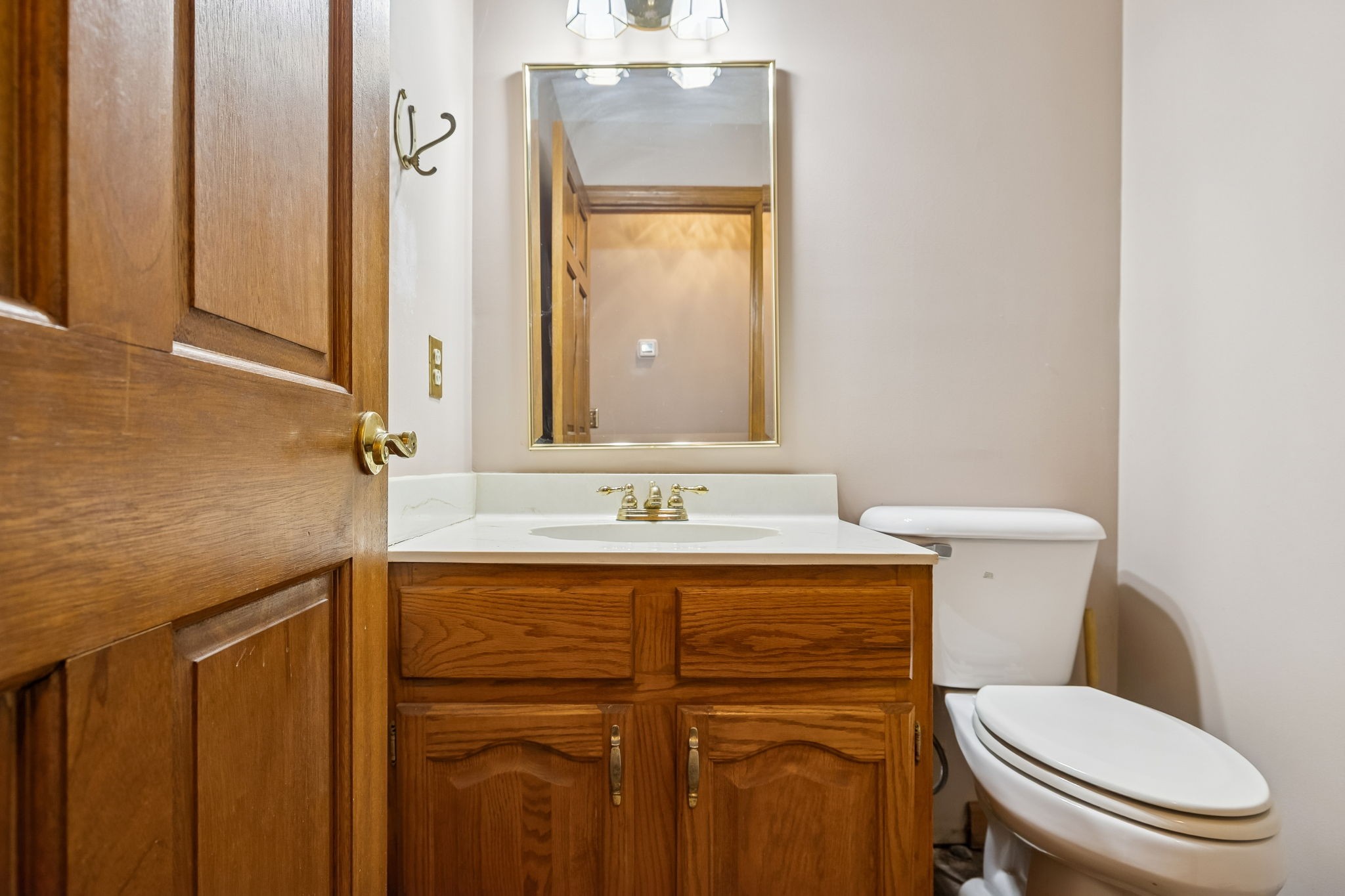121 Kimberly Lane Pleasant View, TN 37146 - Photo 24 of 42 a bathroom with a granite countertop toilet sink and mirror