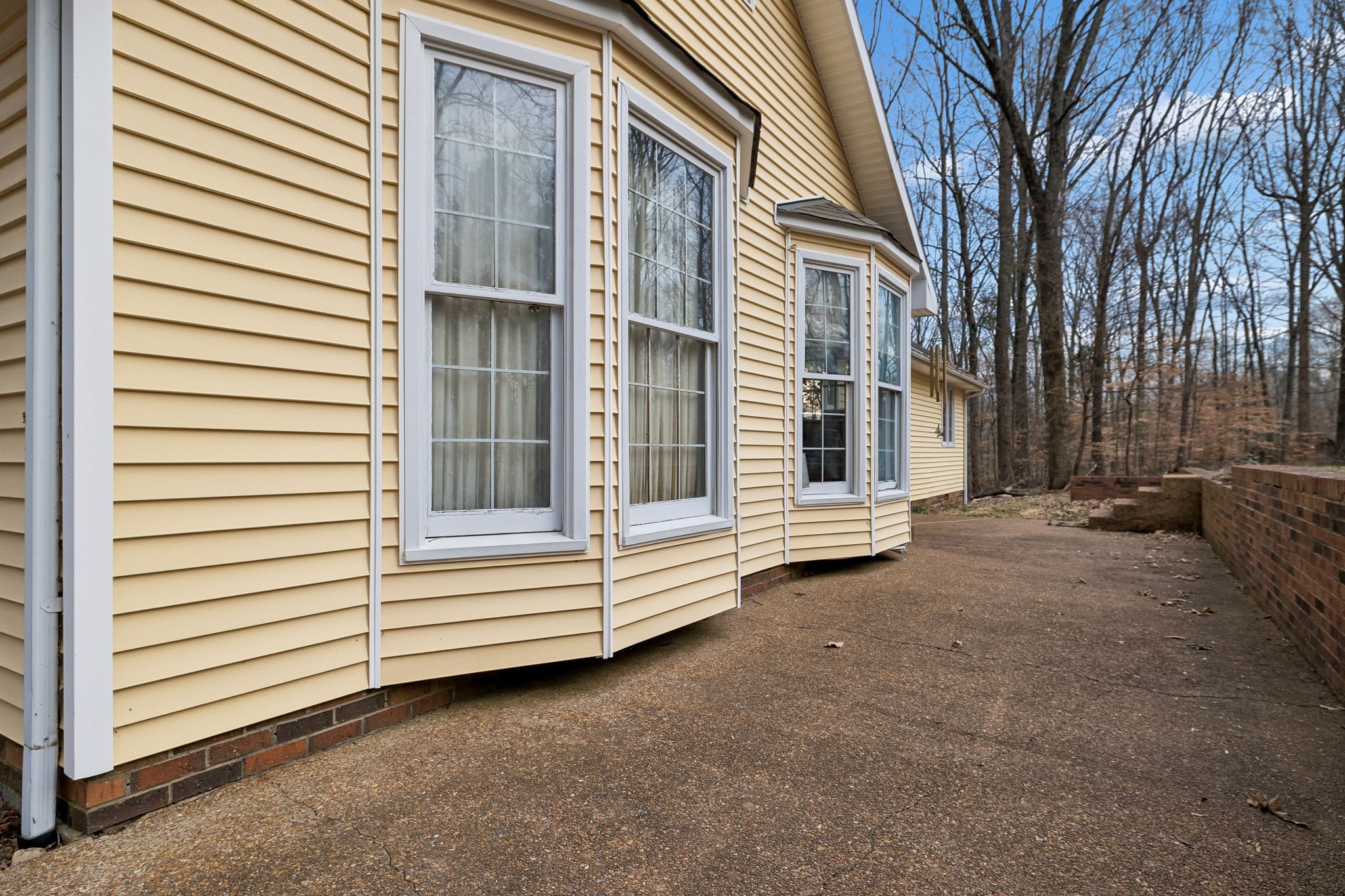 121 Kimberly Lane Pleasant View, TN 37146 - Photo 35 of 42 a view of a house with a yard and garage