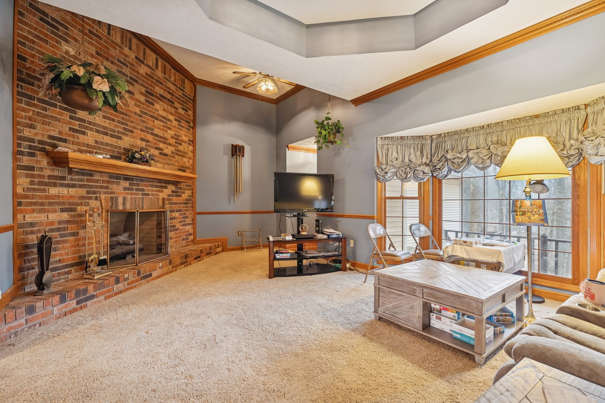 121 Kimberly Lane Pleasant View, TN 37146 - Photo 7 of 42 a living room with fireplace furniture and a flat screen tv