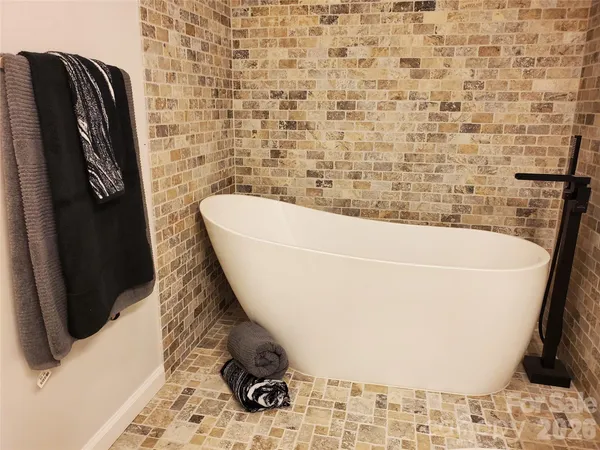 a bathroom with a bathtub