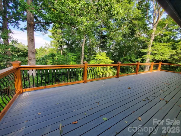 a view of deck with a large trees