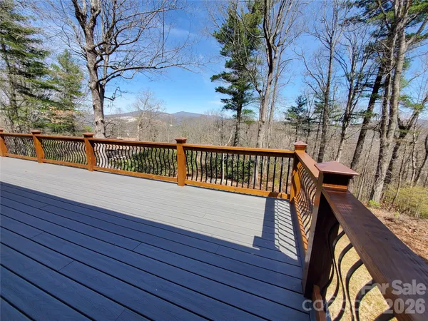 a view of outdoor space with deck and stairs
