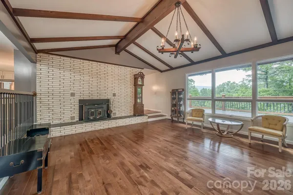 a view of a livingroom with furniture and a fireplace