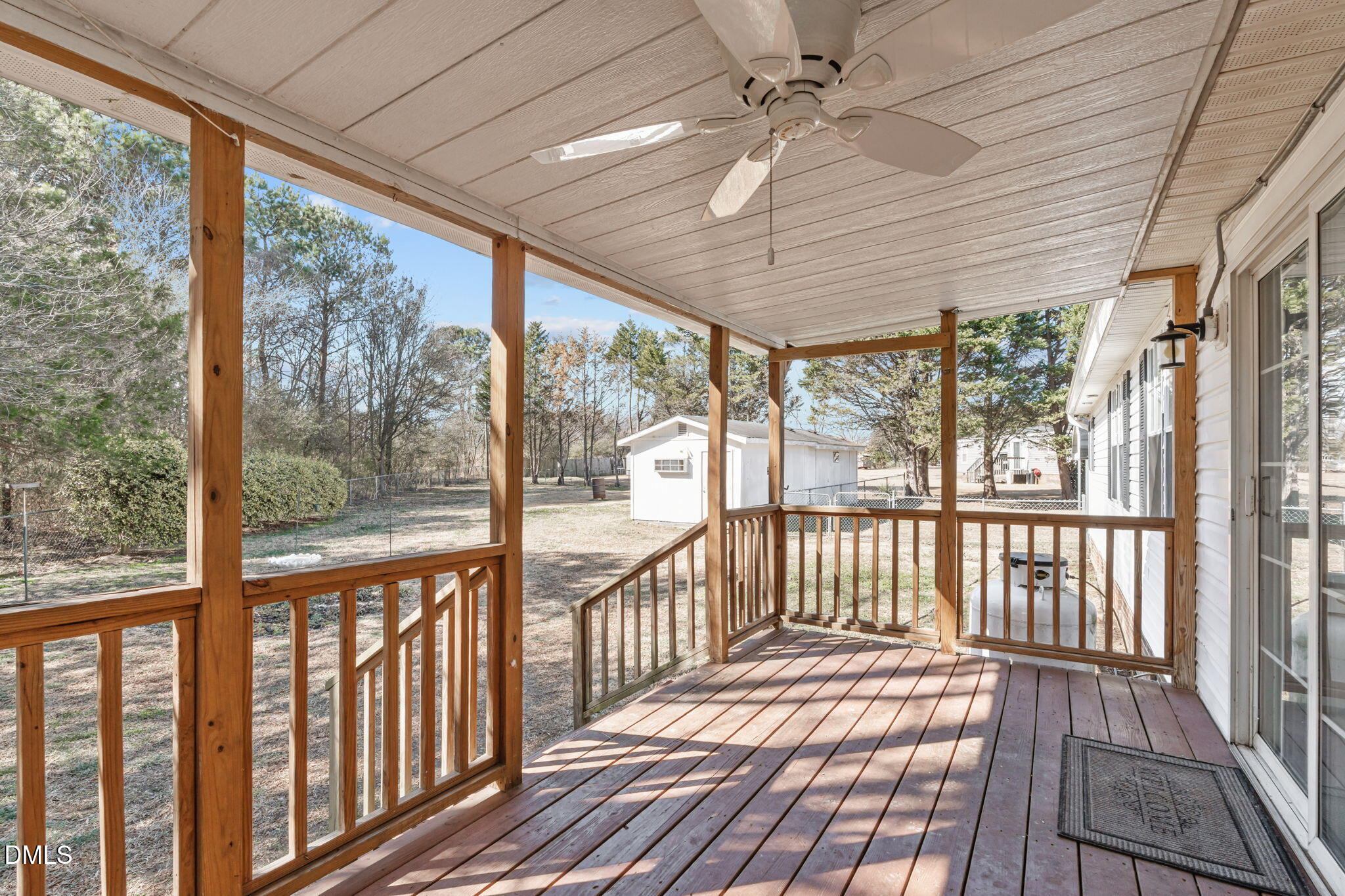 7900 Barbour Store Road Willow Spring, NC 27592 - Photo 26 of 38 Ceiling fan for extended living space outside.