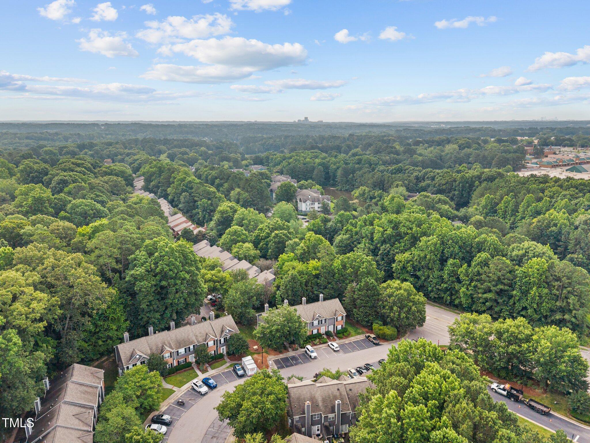 4406 Still Pines Drive Raleigh, NC 27613 - Photo 33 of 39 an aerial view of a city with lots of residential buildings